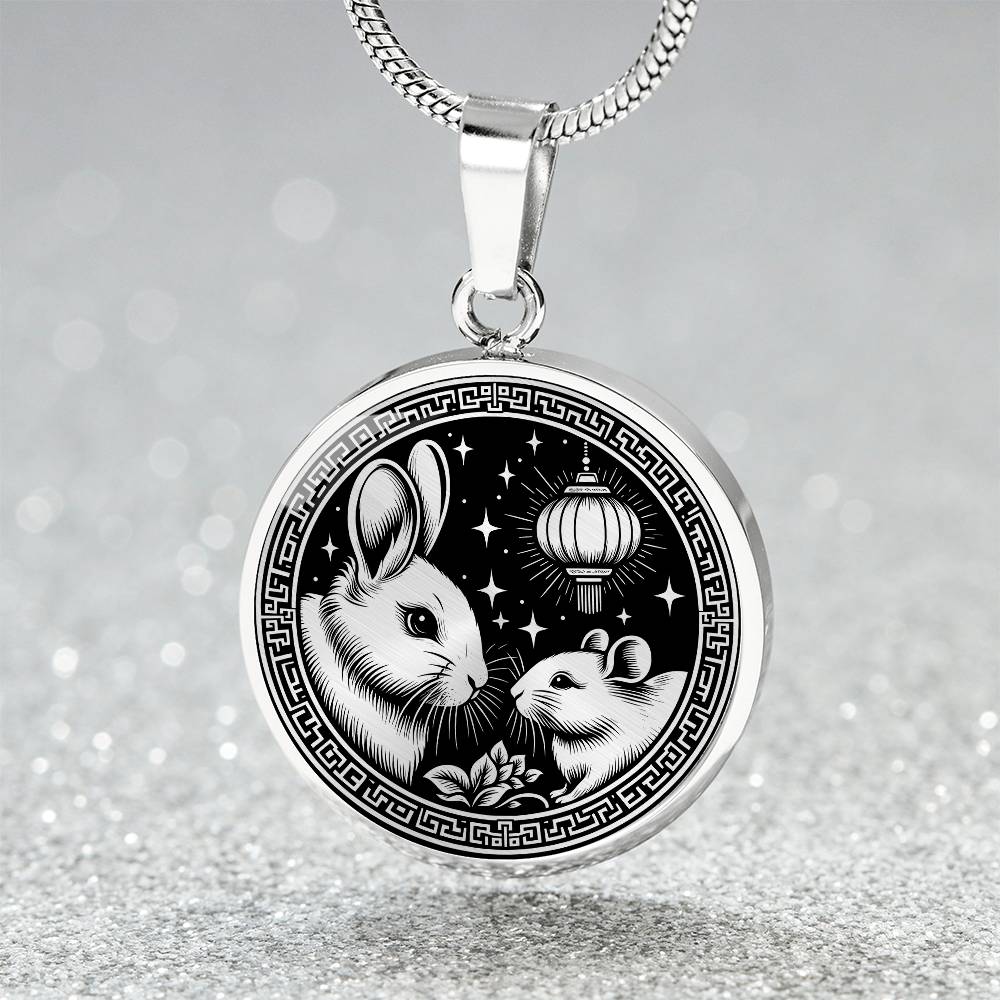 An Elegant silver pendant featuring a Year of the Rat and Year of The Rabbit Necklace in silver and black. This jewelry offers personalization with an engraving option for a name.