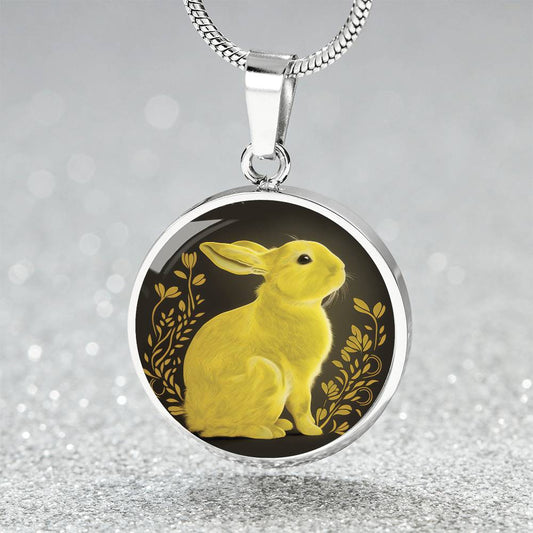 An Elegant silver pendant Rabbit Necklace. Yellow Rabbit and Flowers with a black and brown backdrop. This jewelry offers personalization with an engraving option for a name.