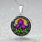 Februarys birth month flower Elegant silver pendant necklace featuring a vivid Purple Iris set against a sunset mountains with a river, the mountains are colored by the metal shinning through. This necklace offers personalization option for a name.