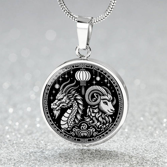 An Elegant silver pendant featuring a Year of the Ram/Sheep and Year of The Dragon Necklace in silver and black. This jewelry offers personalization with an engraving option for a name.