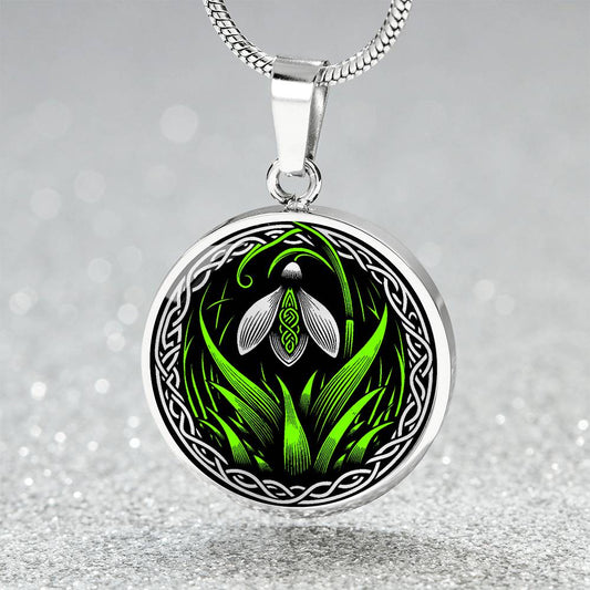 Elegant silver pendant featuring a vivid Snowdrop Birth Flower Necklace, January birth month flower, set against a Green & Black backdrop with a Celtic border. This jewelry offers personalization with an engraving option for a name.