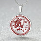 Elegant silver pendant necklace featuring a vivid red Dragon, set against a silver backdrop. This jewelry offers personalization with an engraving option for a name.