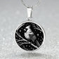 An Elegant silver pendant featuring a vivid Silver Northern Cardinal Necklace with Stars and a tree Branch all in a silver and black backdrop. This jewelry offers personalization with an engraving option for a name.