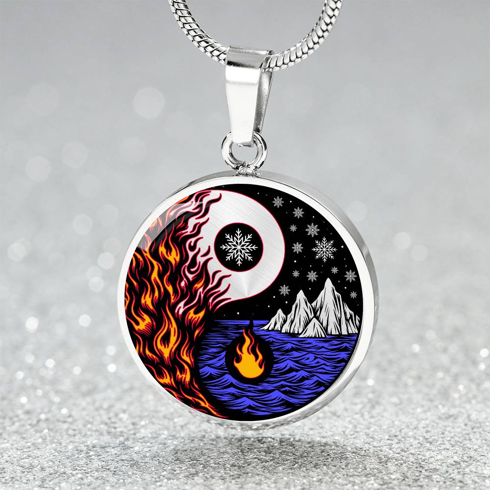 Elegant silver pendant featuring a vivid Red/Orange Fire, Blue Water, Silver snow flakes and Silver Icebergs. set against a silver & Black backdrop. This jewelry offers personalization with an engraving option for a name.