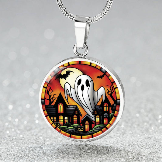 An elegant silver pendant Halloween Ghost Necklace. The colors are white, black, yellow, orange and green. This jewelry offers personalization with an engraving option for a name.