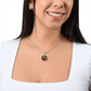 Woman wearing an Elegant silver pendant Year of the Rabbit and Year of the Dragon Necklace. The colors are yellow, Red and Black . This jewelry offers personalization with an engraving option for a name.