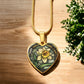 an Elegant gold pendant featuring a vivid Daffodil Birth Flower Necklace, March birth month flower, set against a Green & Tan backdrop. This jewelry offers personalization with an engraving option for a name.