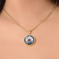 Woman wearing an Elegant gold pendant Anemone Necklace. The Colors are Purple Gray, Dark Green. This jewelry offers personalization with an engraving option for a name.