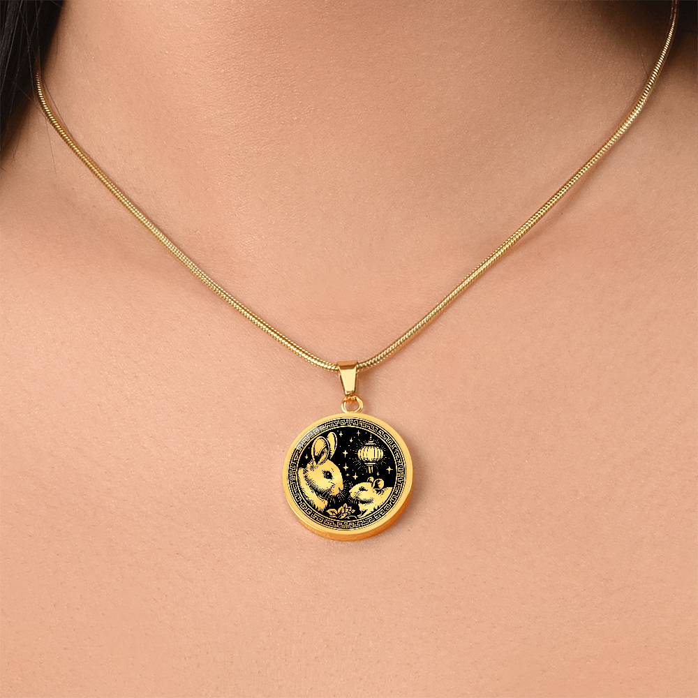 Woman wearing An Elegant gold pendant featuring a Year of the Rat and Year of The Rabbit Necklace in gold and black. This jewelry offers personalization with an engraving option for a name.