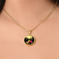 Woman wearing an elegant gold pendant Red Cardinal Necklace. The colors are gold, red and black. This jewelry offers personalization with an engraving option for a name.