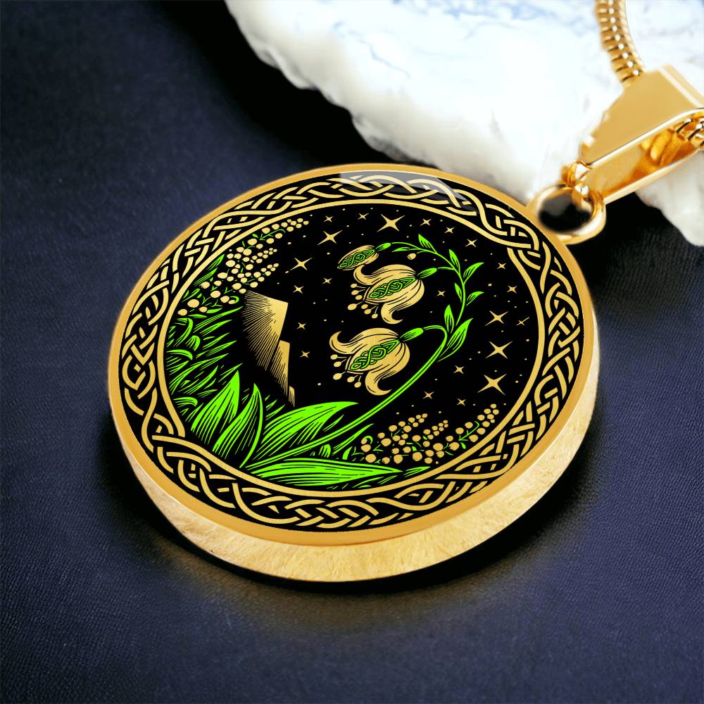 An Elegant gold pendant Celtic Lily Of The Valley Necklace featuring Green Grass, gold Mountains, Stars,  Lily Of The Valleys, Celtic Knot Frame with a black backdrop. This jewelry offers personalized engraving option for a name.