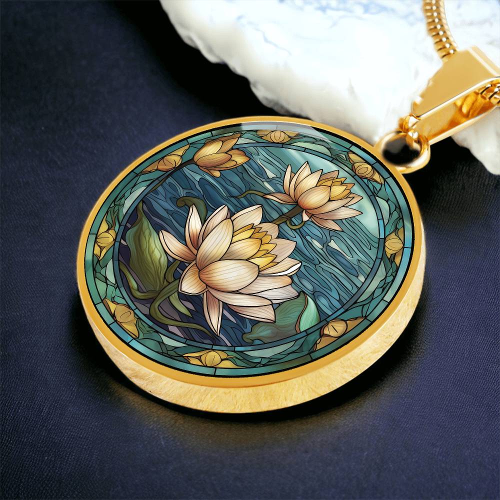 an elegant gold pendant Water Lily Necklace. The colors are Green Leaves, Blue Water and Tan Flowers. This jewelry offers personalization with an engraving option for a name.