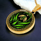Elegant gold pendant featuring a vivid Snowdrop Birth Flower Necklace, January birth month flower, set against a Green & Black backdrop with a Celtic border. This jewelry offers personalization with an engraving option for a name.