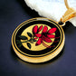 Elegant gold pendant featuring a vivid red honeysuckle, Junes birth month flower, set against a subtle tan backdrop. This necklace offers personalization with an engraving option for a name.