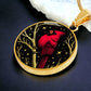 An Elegant gold pendant featuring a vivid Red Northern Cardinal Necklace with Stars and a tree Branch all in a gold and black backdrop. This jewelry offers personalization with an engraving option for a name.