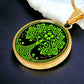 Elegant Gold pendant featuring a vivid Green Celtic four leaf Clover Tree of Life Necklace, set against a Black & gold backdrop. This jewelry offers personalization with an engraving option for a name.