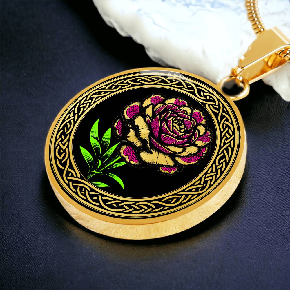 Elegant January gold pendant Celtic Carnation Birth Flower necklace featuring a vivid pink, green and gold flower, set against a black backdrop. This jewelry offers personalization with an engraving option for a name.