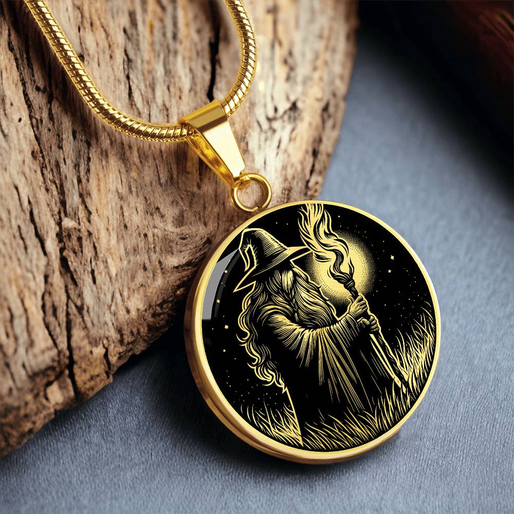 An Elegant gold pendant featuring a Fantasy Wizard Necklace in gold and black. This jewelry offers personalization with an engraving option for a name.