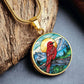 An Elegant gold pendant Red Bird Necklace. featuring a Sunny blue sky with mountains, blue lake and green forest. This jewelry offers personalization with an engraving option for a name.