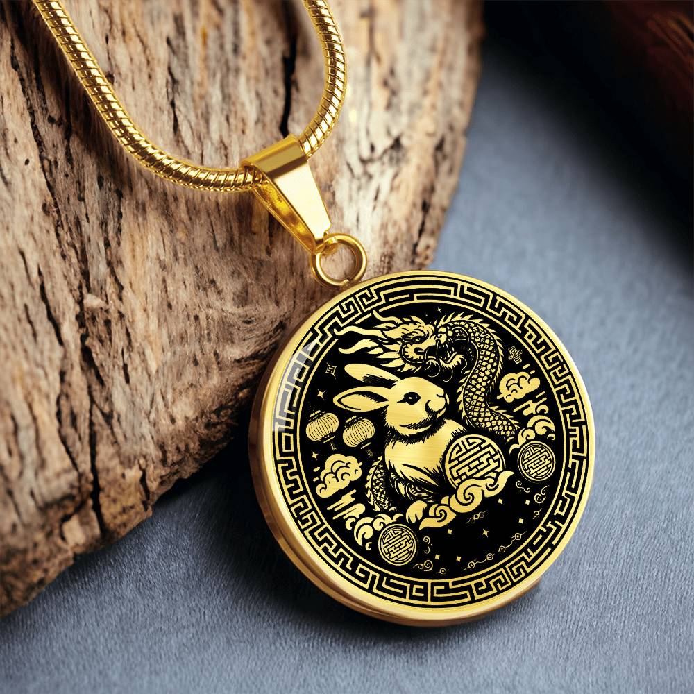 This Year of the dragon necklace. Elegant gold pendant with a rabbit & dragon, is set against a gold backdrop. This jewelry offers personalization with an engraving option for a name.