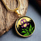 Februarys birth month flower Elegant gold pendant featuring a vivid Purple Iris Necklace set against a Green Grass, Gold sun and mountains background. This necklace offers personalization option for a name.