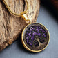 an elegant gold pendant Larkspur Tree of Life Necklace. The Colors are purple, green and brown. This jewelry offers personalization with an engraving option for a name.