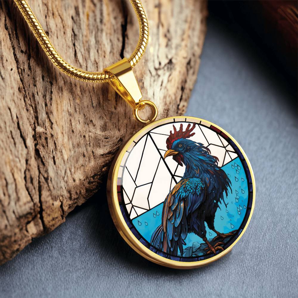 An Elegant gold pendant featuring a Chinese Zodiac Rooster Necklace. The colors are blue, white, tan, red, yellow, brown. This jewelry offers personalization with an engraving option for a name.