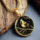 An Elegant gold pendant featuring a vivid gold Northern Cardinal Necklace with Stars and a tree Branch all in a gold and black backdrop. This jewelry offers personalization with an engraving option for a name.