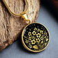 an Elegant gold pendant featuring a vivid African Violet Birth Flower Necklace, set against a subtle gold and Black backdrop. This jewelry offers personalization with an engraving option for a name.