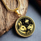 An Elegant gold pendant featuring a Year of the Rat and Year of The Rabbit Necklace in gold and black. This jewelry offers personalization with an engraving option for a name.