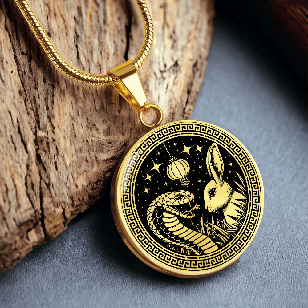 An Elegant gold pendant featuring a Year of the Rabbit and Year of The Snake Necklace in real gold and black. This jewelry offers personalization with an engraving option for a name.