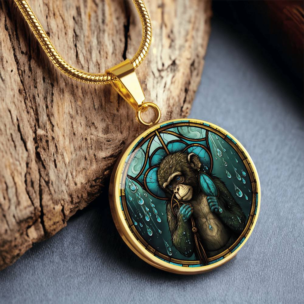 An elegant gold pendant Chinese Zodiac Monkey Necklace. The colors are yellow, blue, teal, brown and green. This jewelry offers personalization with an engraving option for a name.