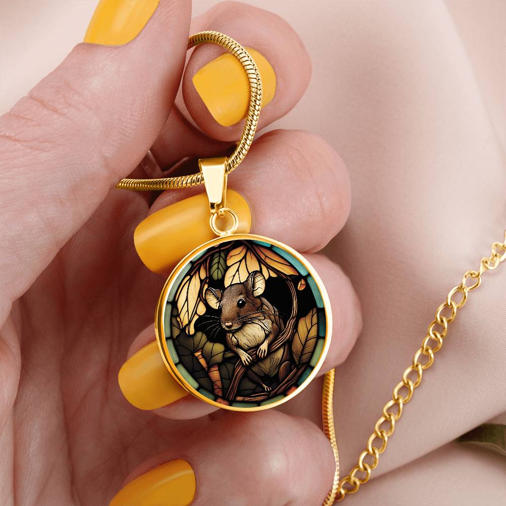 Woman holding an Elegant gold pendant Rat necklace. Brown Rat, Brown Twigs, yellow and green leaves, blue, orange and green border. This jewelry offers personalization with an engraving option for a name.