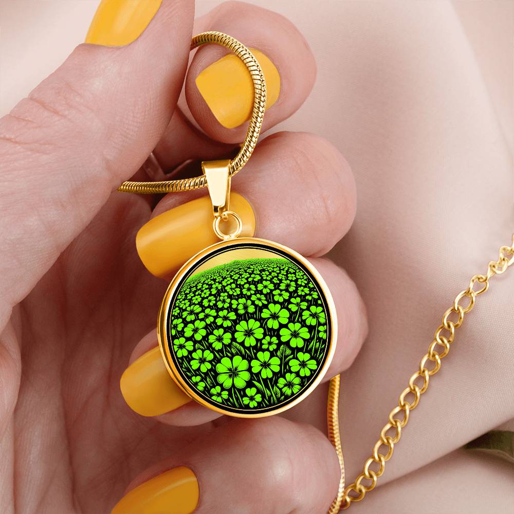 Woman holding an Elegant gold pendant necklace featuring a vivid Green Clover Field set against a Gold & black backdrop. This necklace offers personalization with an engraving option for a name.