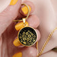 Woman holding an Elegant gold pendant featuring a vivid African Violet Birth Flower Necklace, set against a subtle gold and Black backdrop. This jewelry offers personalization with an engraving option for a name.