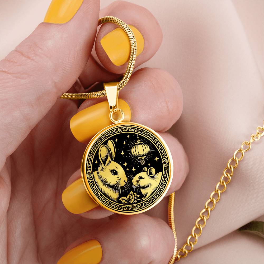 Woman holding An Elegant gold pendant featuring a Year of the Rat and Year of The Rabbit Necklace in gold and black. This jewelry offers personalization with an engraving option for a name.