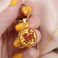 Woman Holding a Gold Tiger Necklace