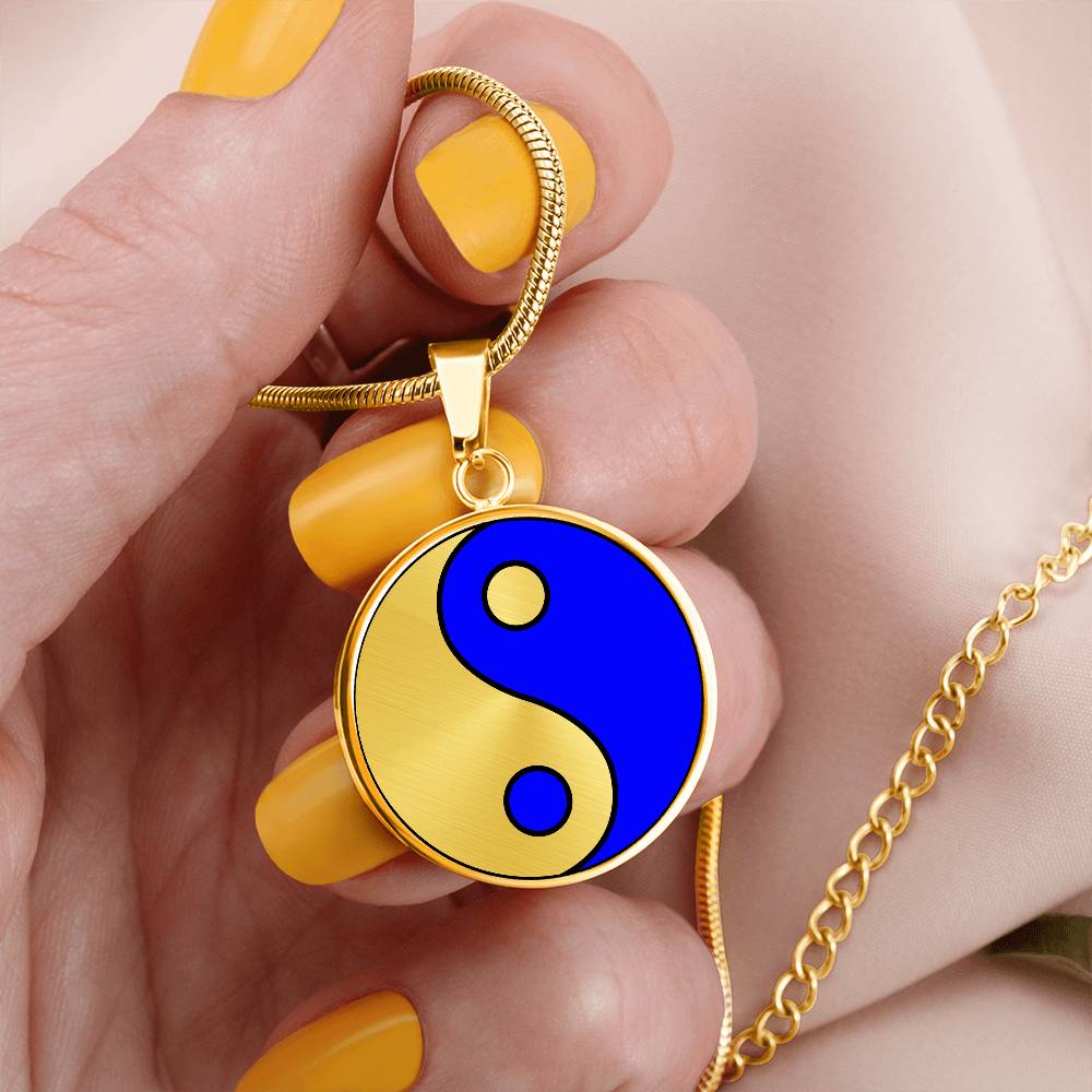 Woman holding a Gold Pendant Fire and Ice Yin Yang Necklace