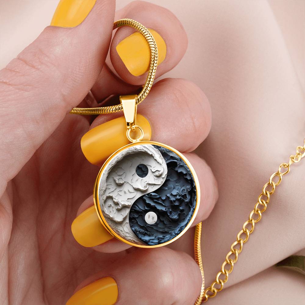 Woman holding a Gold Yin Yang Necklace