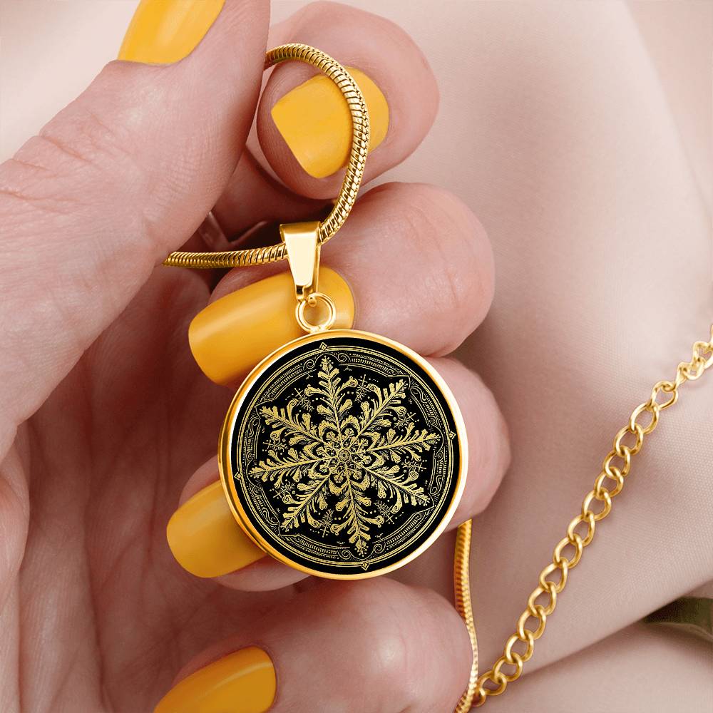 Woman holding an Elegant gold pendant necklace featuring a vivid Gold Snowflake , set against a Black backdrop. This necklace offers personalization with an engraving option for a name.