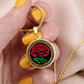 Woman holding an elegant Celtic gold pendant January Birth Flower Carnation necklace. A vivid red carnation, green stem & leaves, set against a gold & black backdrop. This jewelry offers personalization with an engraving option for a name.