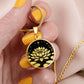 Woman holding An Elegant gold pendant Water Lily Necklace featuring Stars, Lily Pads and a Water lily, all in black and gold. This jewelry offers personalization with an engraving option for a name.