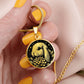 Woman holding an Elegant gold pendant Water Lily Bunny necklace. Colors are gold with a black background. This jewelry offers personalization with an engraving option for a name.