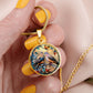 Woman holding an Elegant gold pendant necklace featuring two turtle doves, set against a subtle tan backdrop. This jewelry offers personalization with an engraving option for a name.