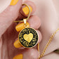 Woman holding An Elegant gold pendant featuring a Valentines Design with a vivid gold Moonlight Heart Necklace, set against a gold/black backdrop with a sword and flowers. This jewelry offers personalization with an engraving option for a name.