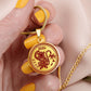 Woman holding a Gold Monkey Necklace