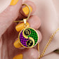 Woman holding an elegant gold pendant Zodiac Necklace. This jewelry offers personalization with an engraving option for a name.