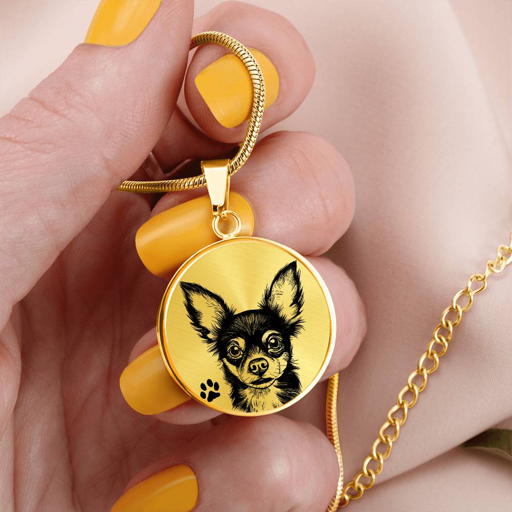 Women holding An Elegant gold pendant Chihuahua Dog Necklace. The Chihuahua Design is in Gold and Black with a black paw print. This jewelry offers personalization with an engraving option for a name.