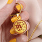 Woman holding an Elegant gold pendant necklace featuring a vivid red Dragon, set against a gold backdrop. This jewelry offers personalization with an engraving option for a name.