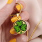Woman holding an Elegant gold pendant necklace featuring a vivid Green Celtic Clover set against a Gold & black backdrop. This necklace offers personalization with an engraving option for a name.